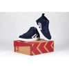 Navy high top adaptive sneakers with laces and zippers for easy on and off, showcasing functional and fashionable design for kids.